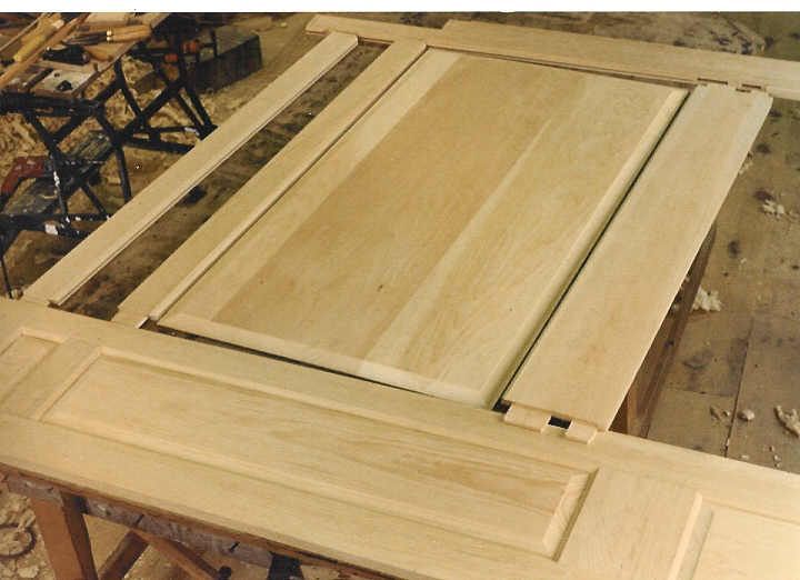 A piece of wood is sitting on top of a wooden table