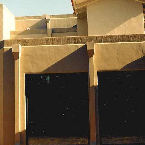 A large building with a lot of windows and doors