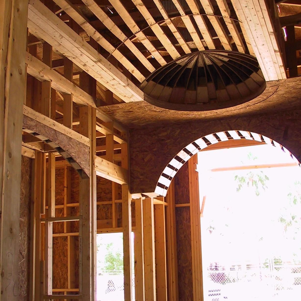 A building under construction with a dome on the ceiling