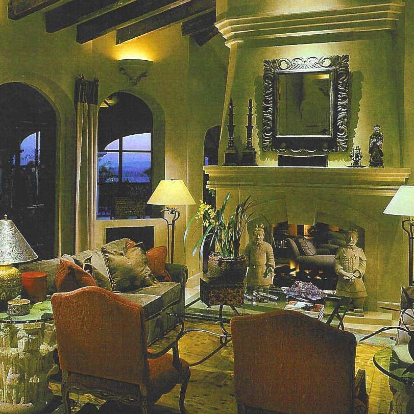 A living room filled with furniture and a fireplace