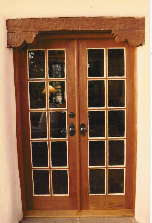 A wooden door with a lot of windows on it