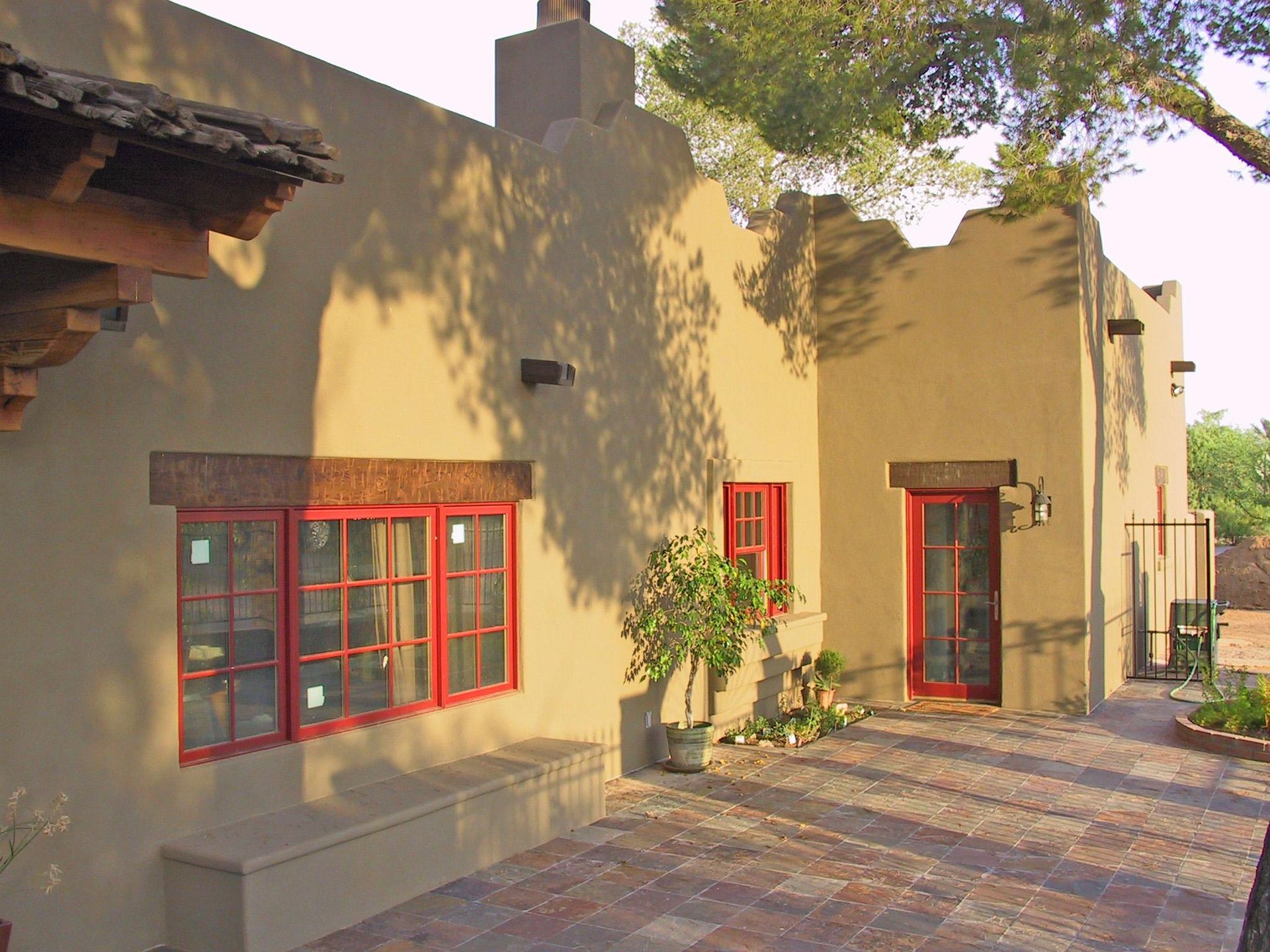 A kitchen with a white counter top and black cabinets