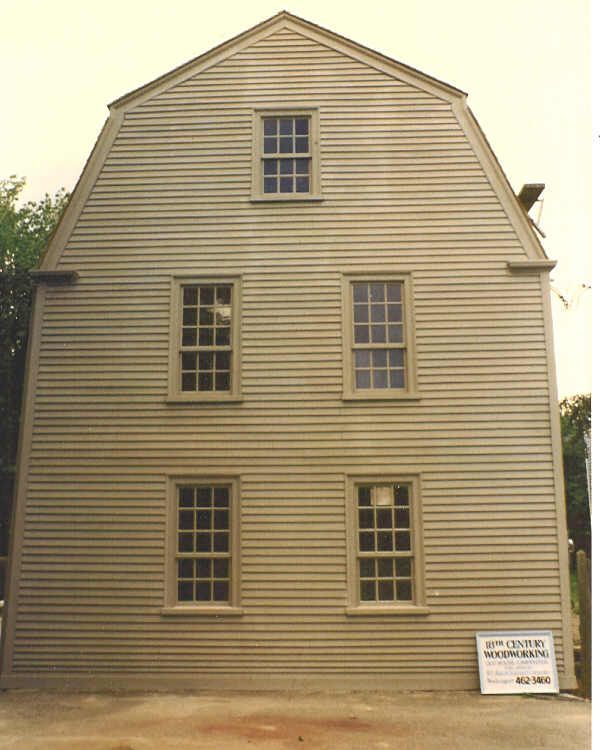 A large house with a sign on the side that says ' a ' on it