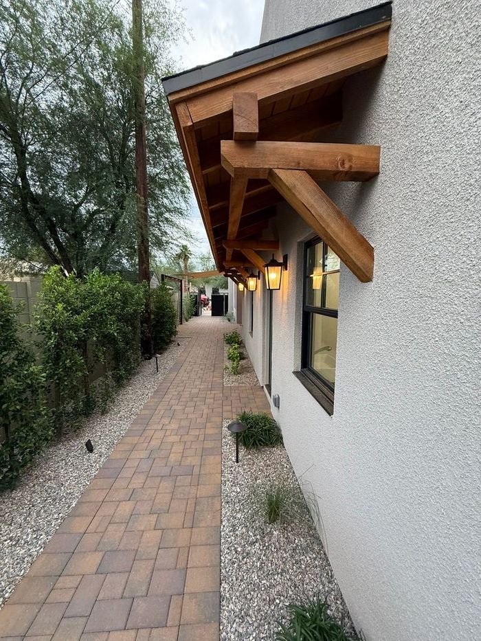 A house with a red door and a gray roof