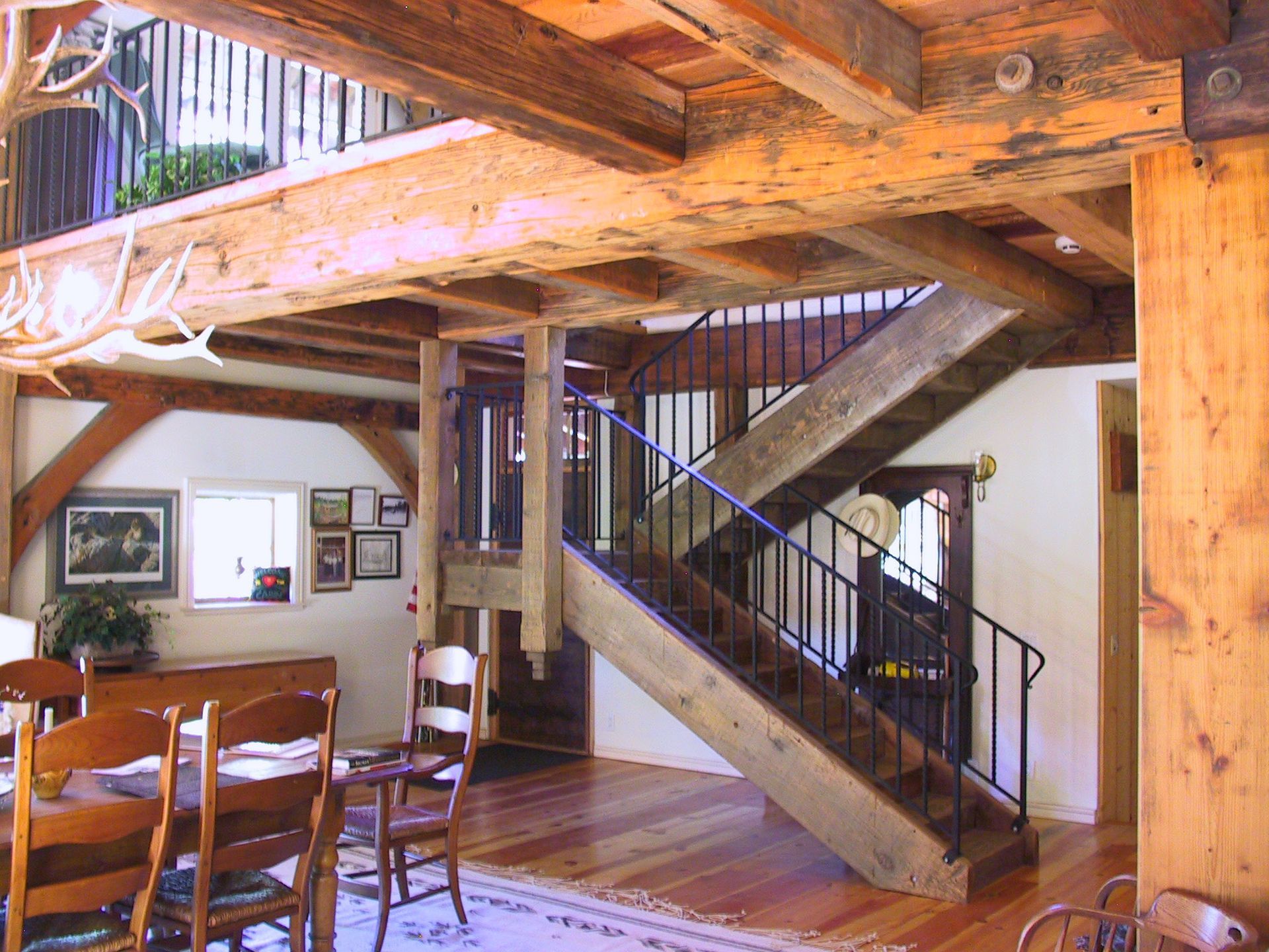 A wooden staircase leading up to the second floor of a house