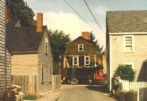 A wooden building with the letter b on it
