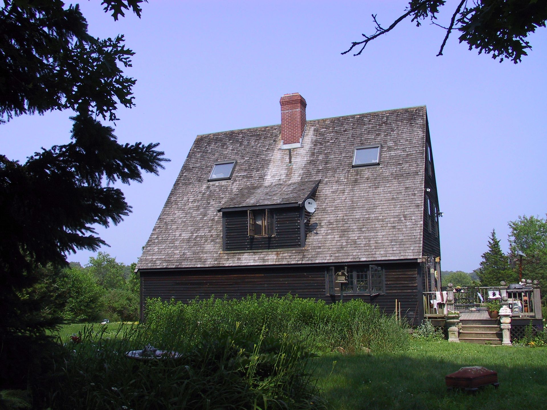 A house with a chimney on the top of it