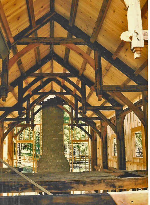 A wooden structure with a chimney in the middle