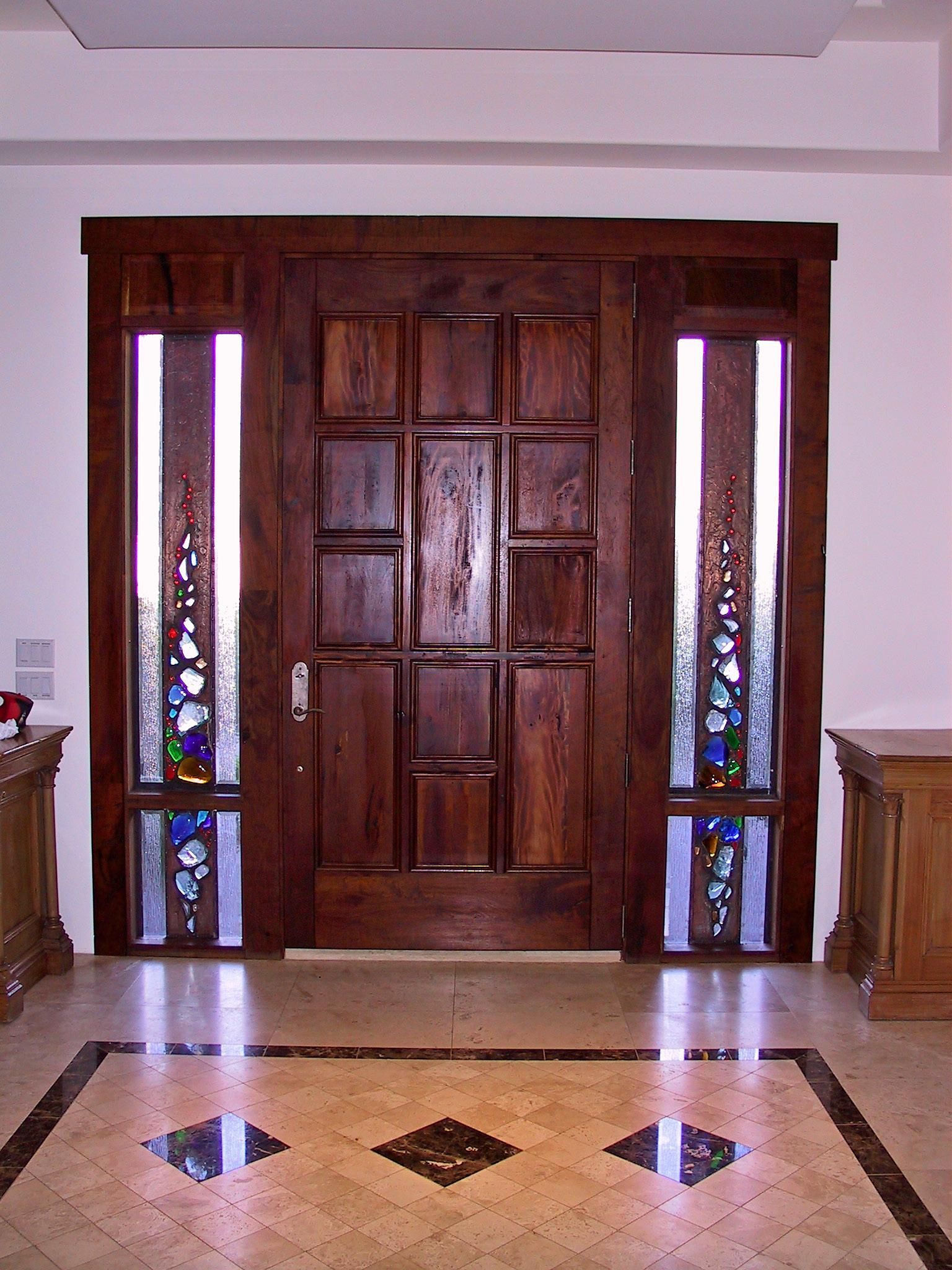A large wooden door with stained glass windows