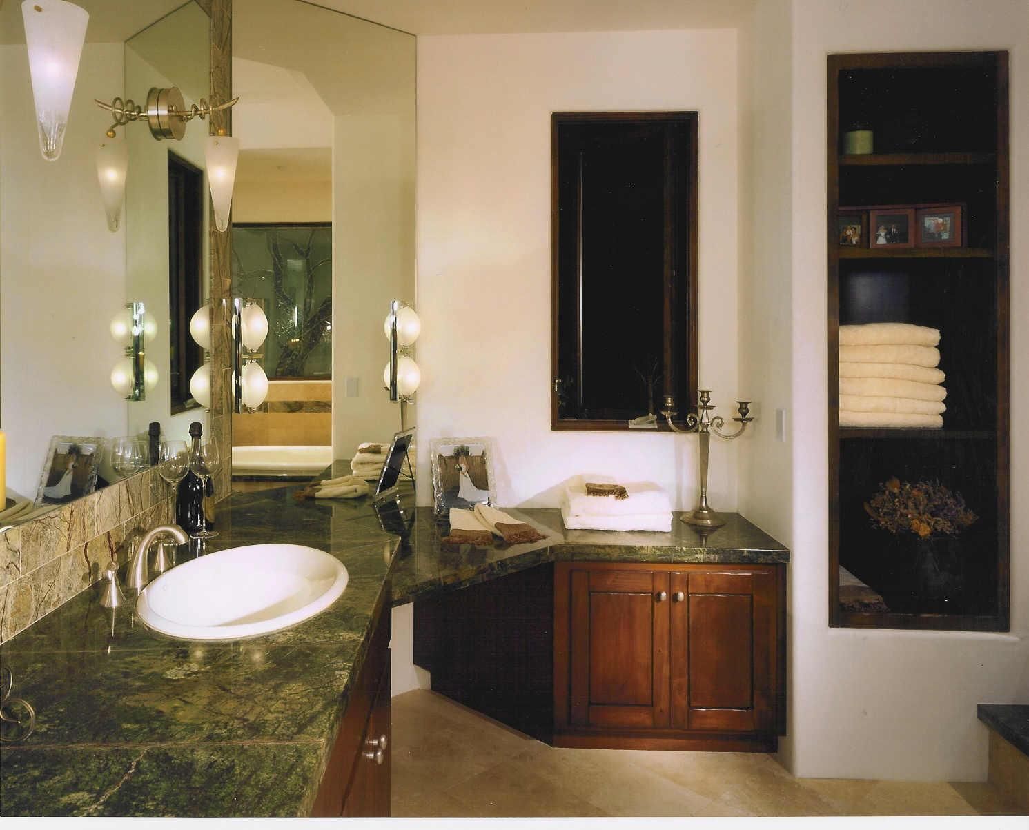 A bathroom with two sinks and a large mirror