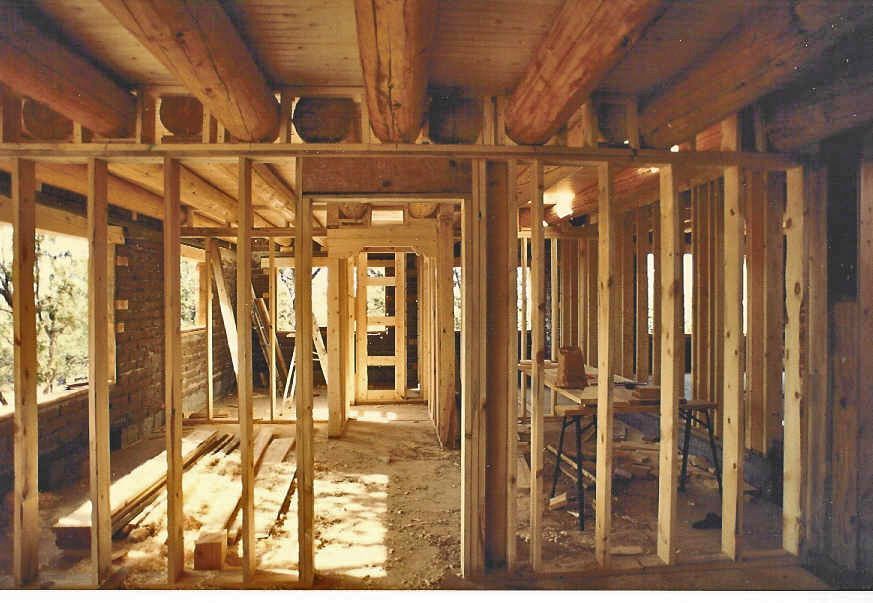 A wooden frame of a building under construction