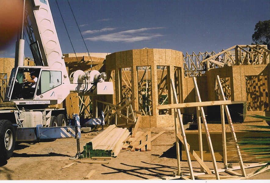 A construction site with a crane in the foreground