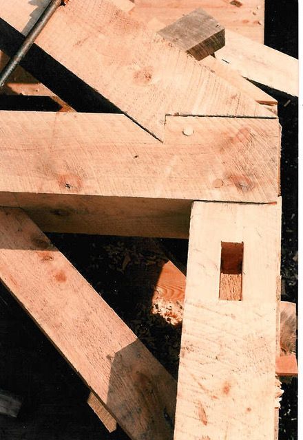 Wooden timber framing with a mortise and tenon joint.