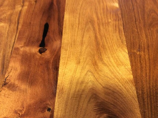 Close-up of hardwood flooring; warm brown and golden tones with natural wood grain.