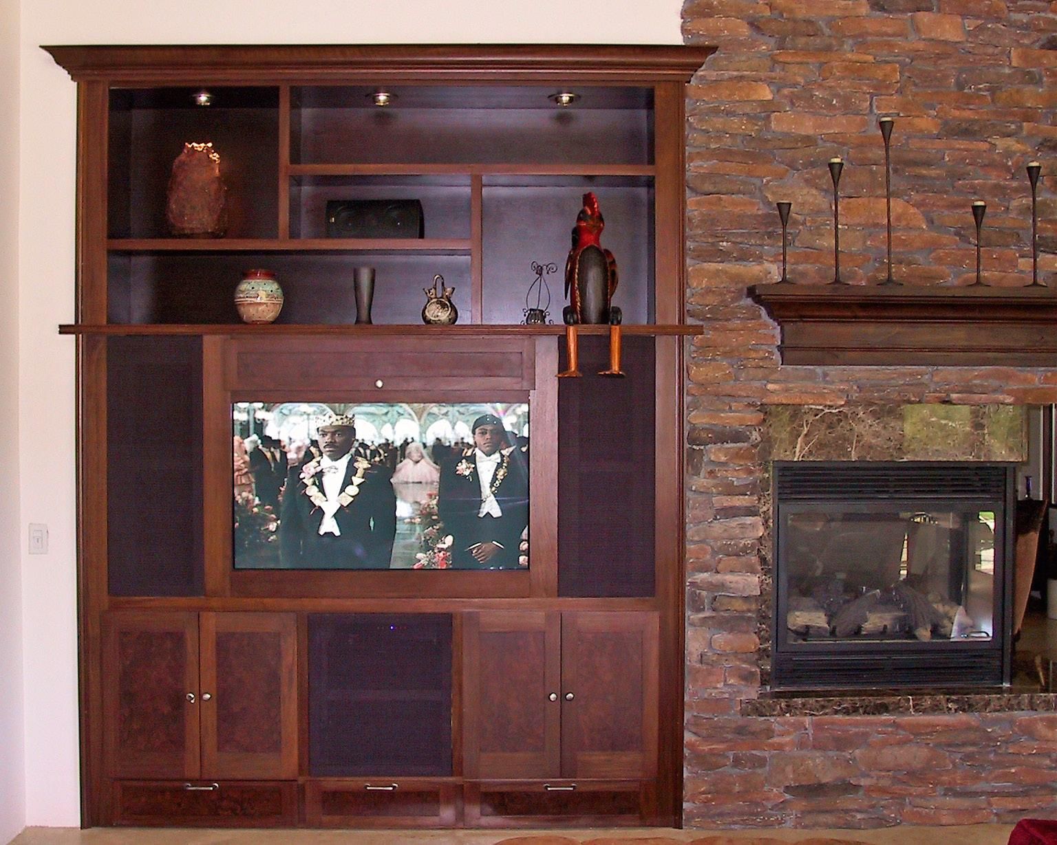 A living room with a tv and a fireplace