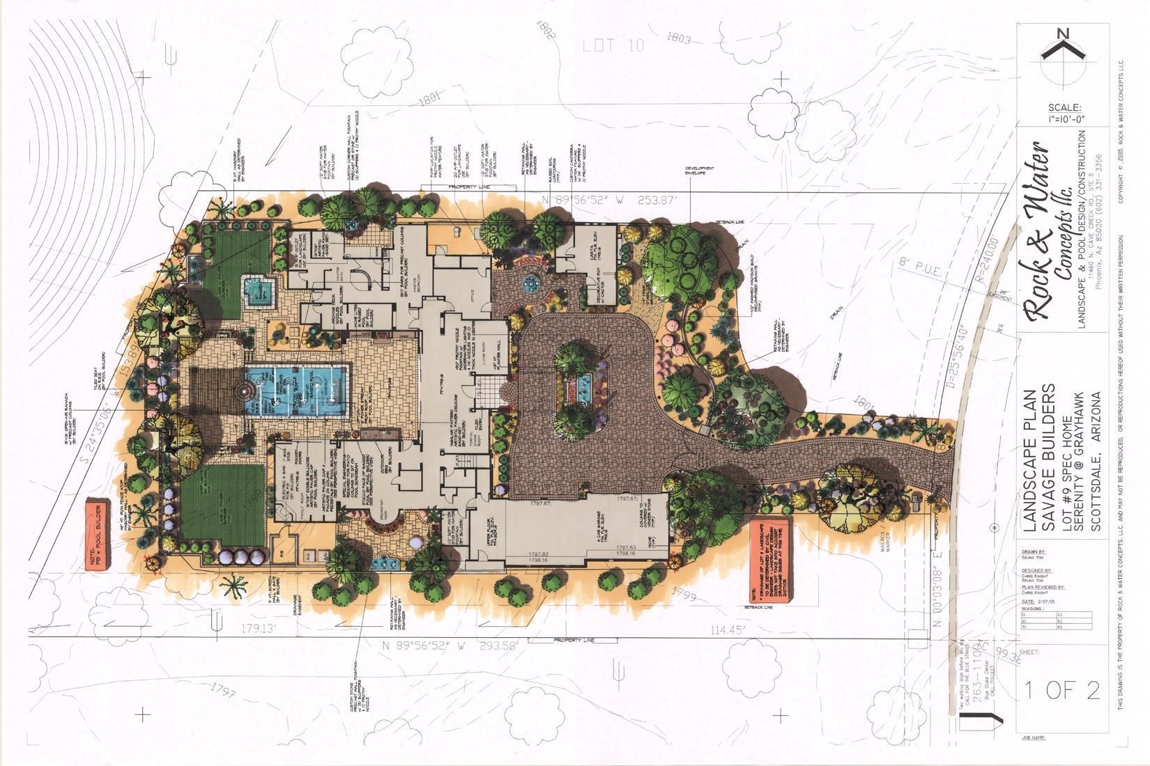 An aerial view of a house with a pool and trees