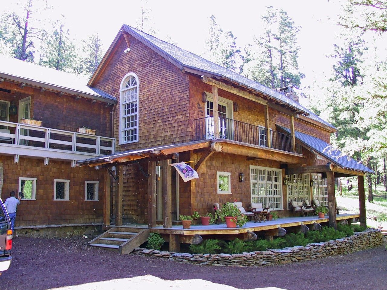 A large wooden house with a flag hanging from it
