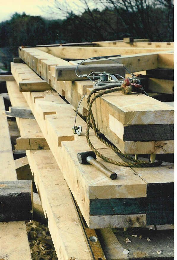 A bunch of wooden beams are stacked on top of each other