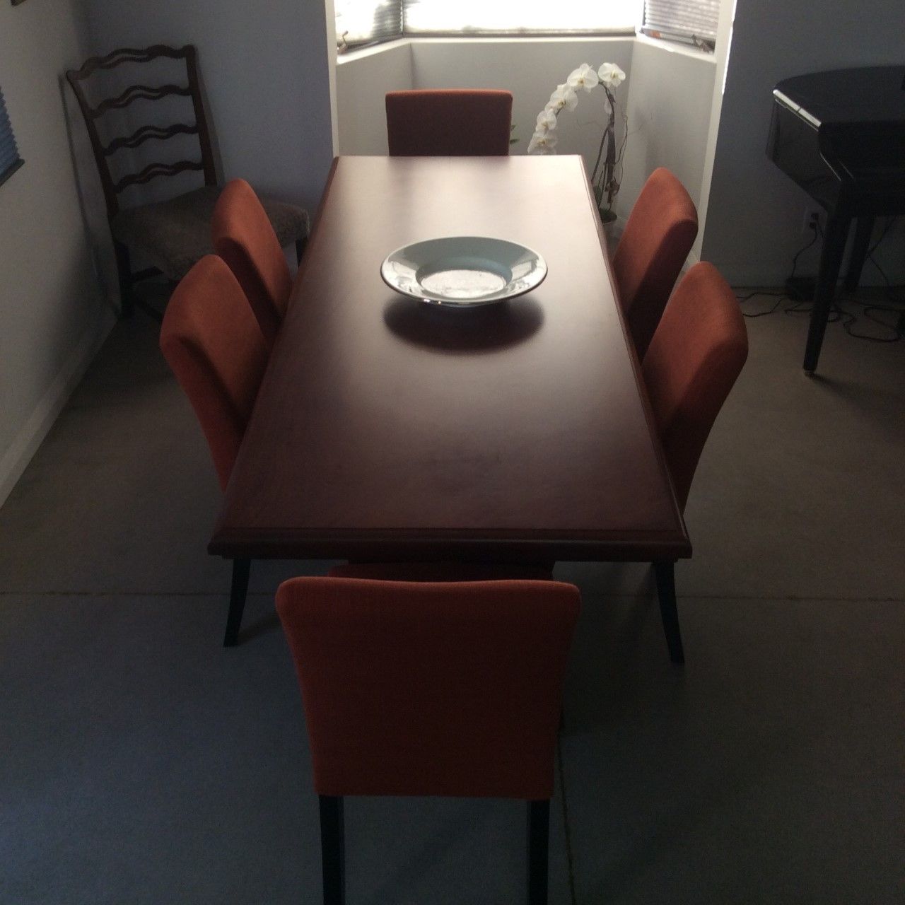 A dining room table with a bowl on top of it