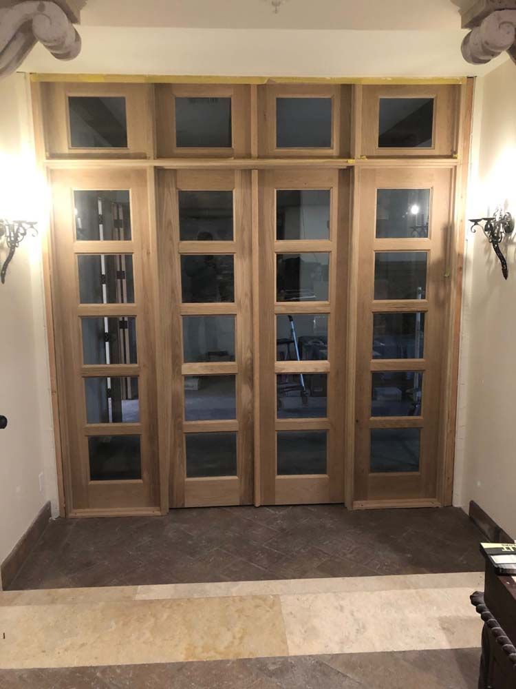 A door with a lot of windows in a room
