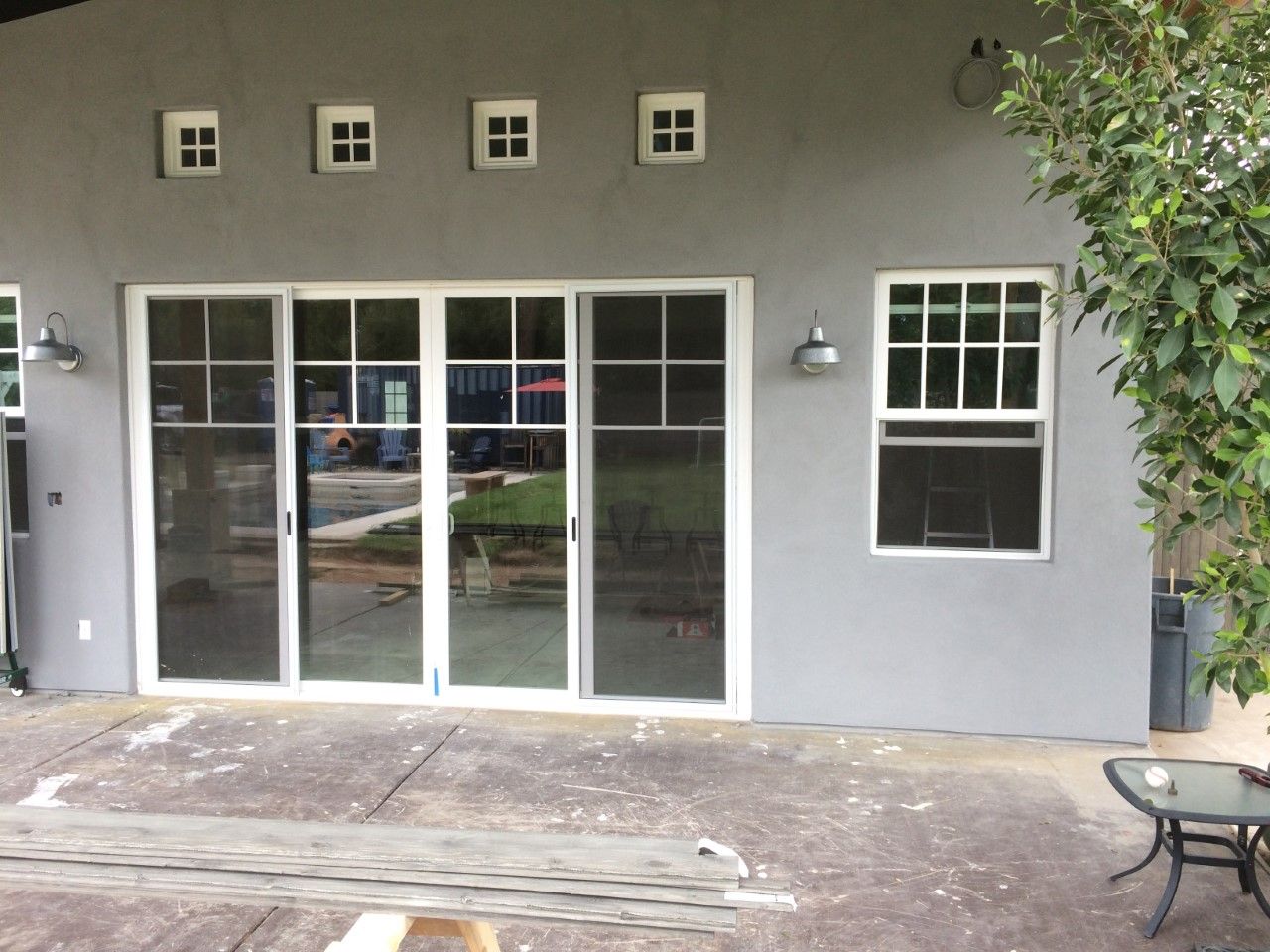 A house with a lot of windows and sliding glass doors