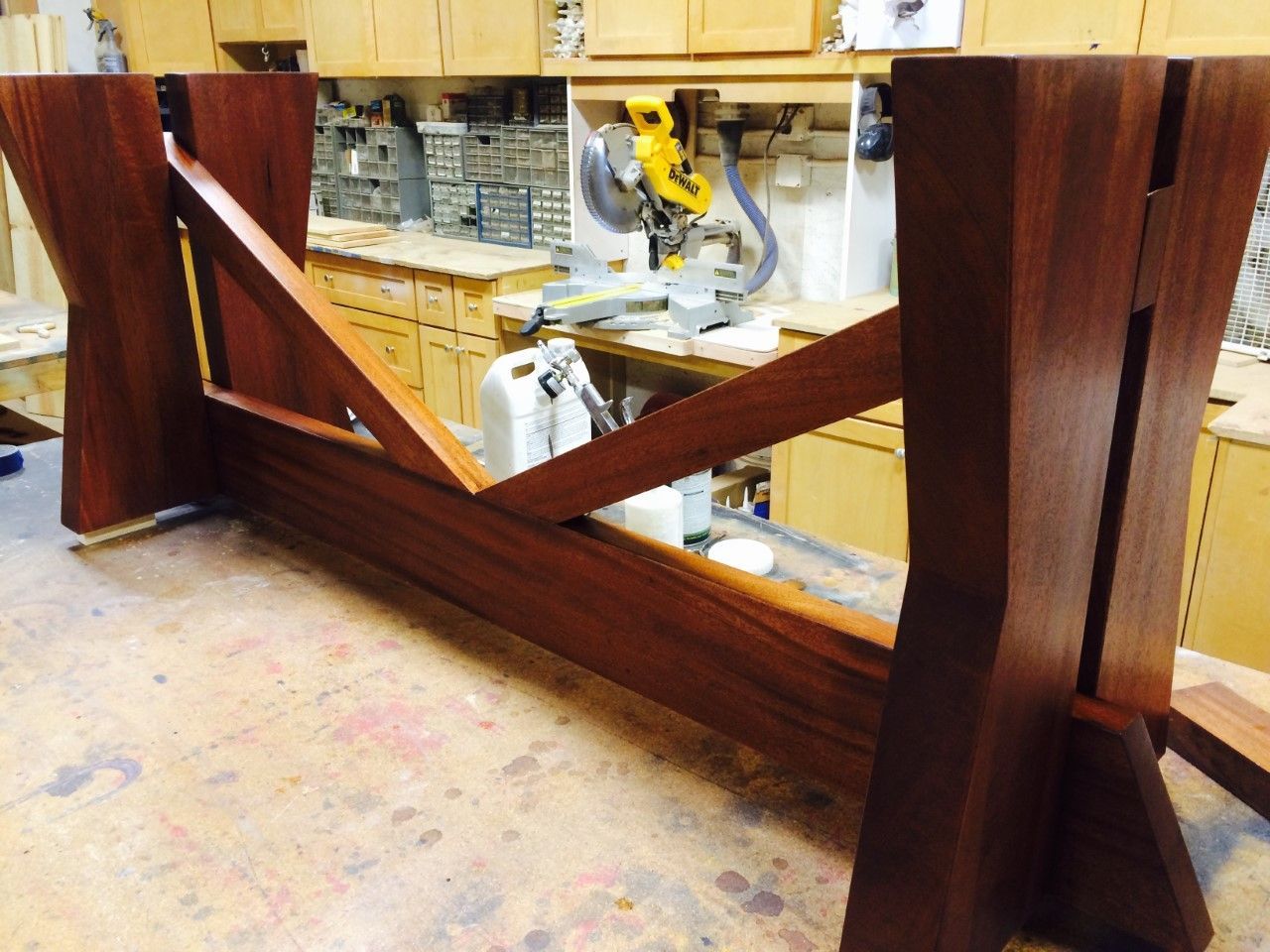 A wooden table is being built in a workshop