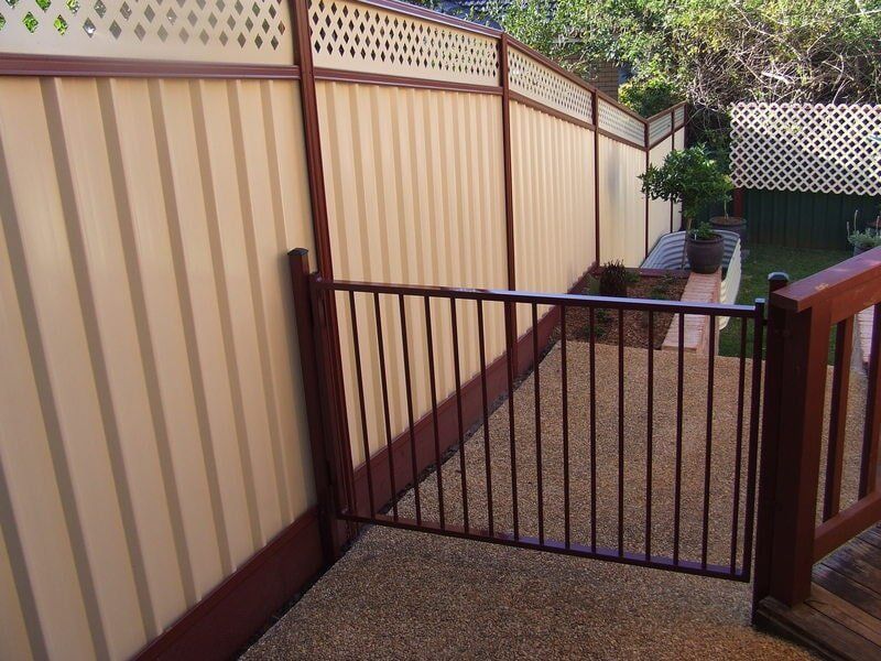 Gray Gate with Modern Fence Beside — Fencing in Port Macquarie, NSW