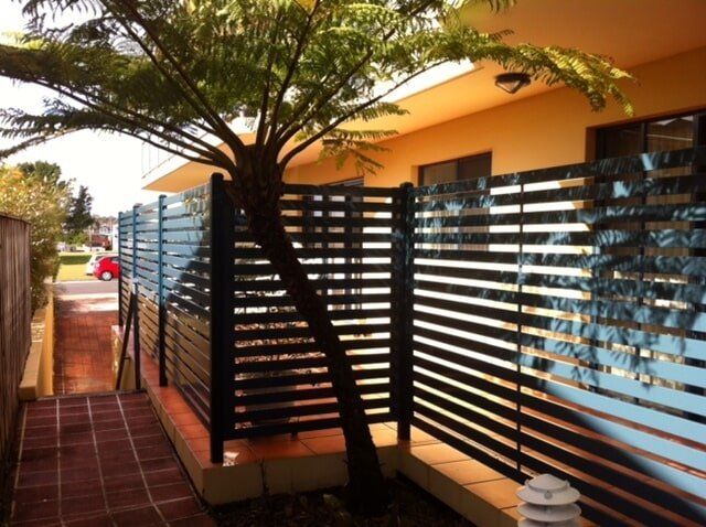 Wooden Fence Behind the Tree — Fencing in Port Macquarie, NSW