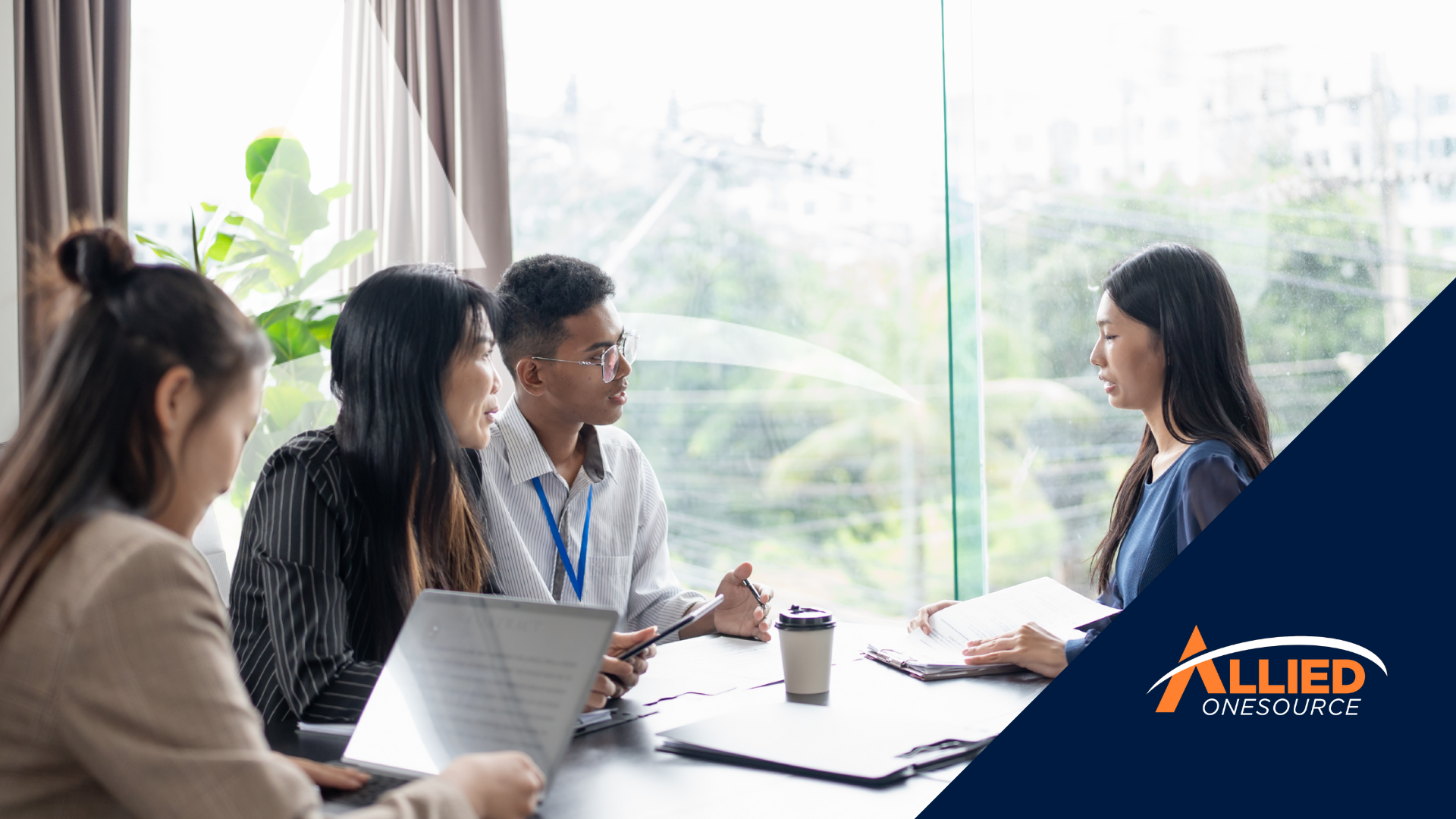 A team of professionals meets around a table to discuss top paying jobs 2026.