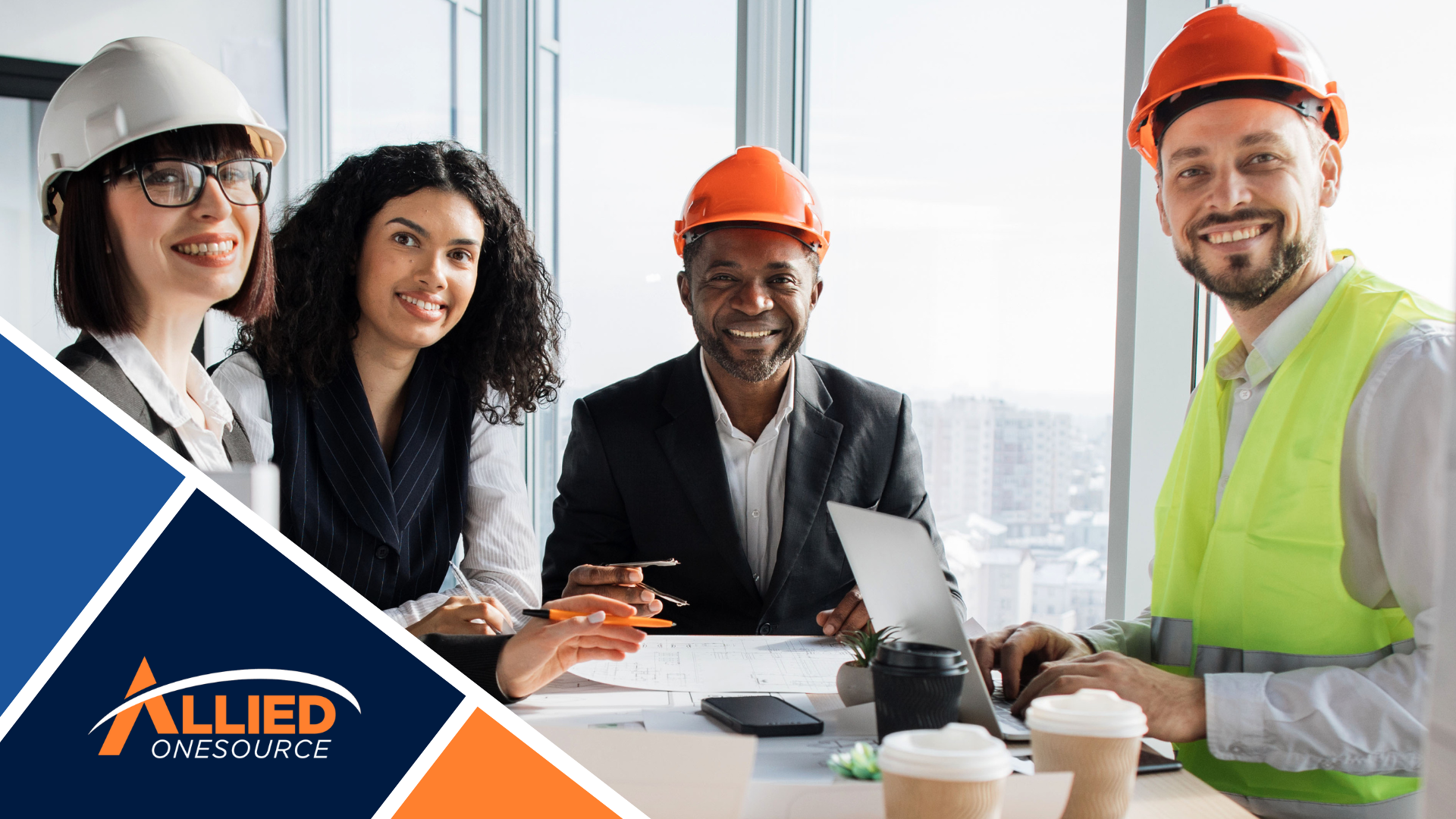 Hiring team reviewing resumes and blueprints to accelerate seasonal hiring in construction sector