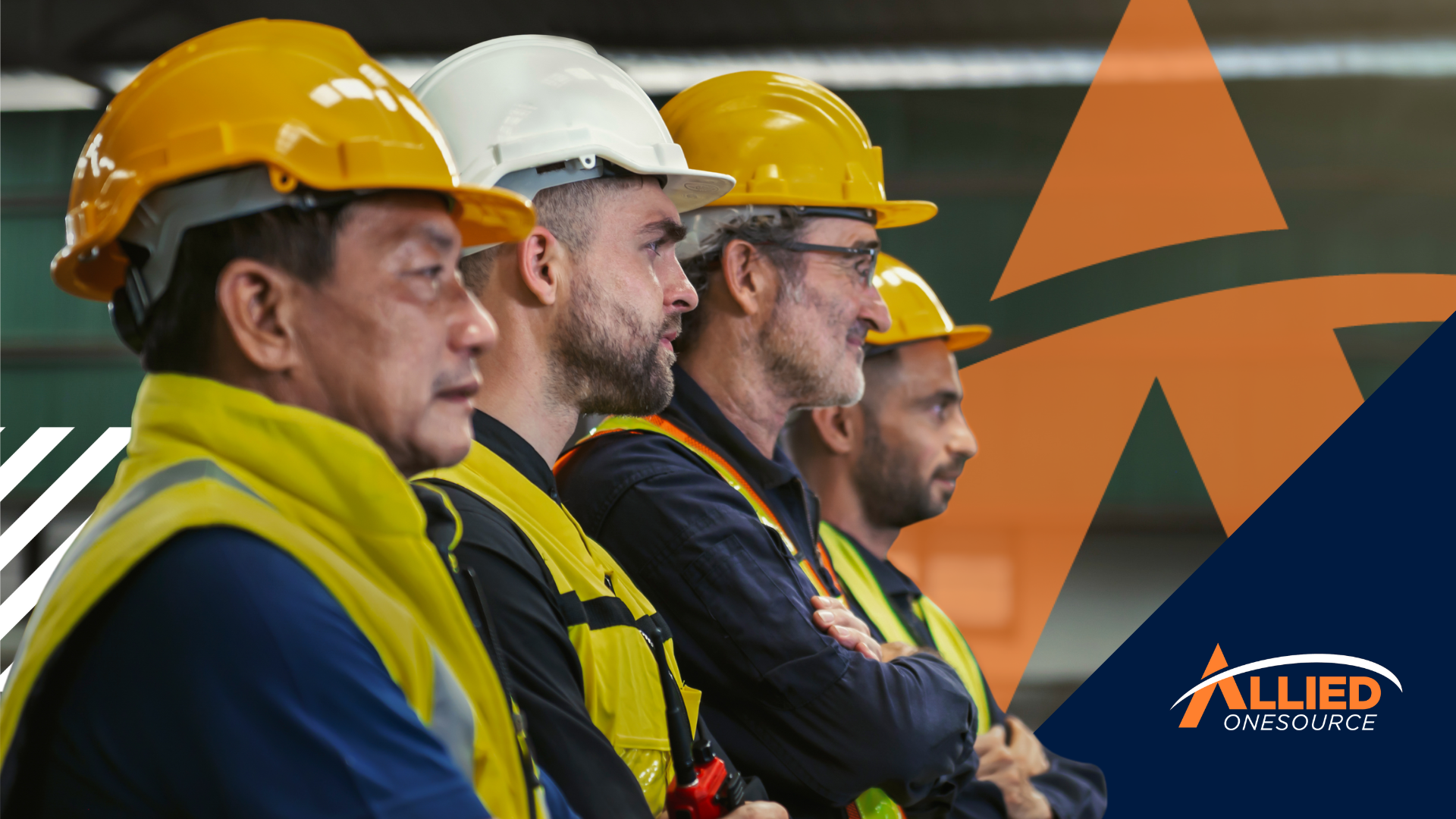 A group of men wearing hard hats and safety vests.