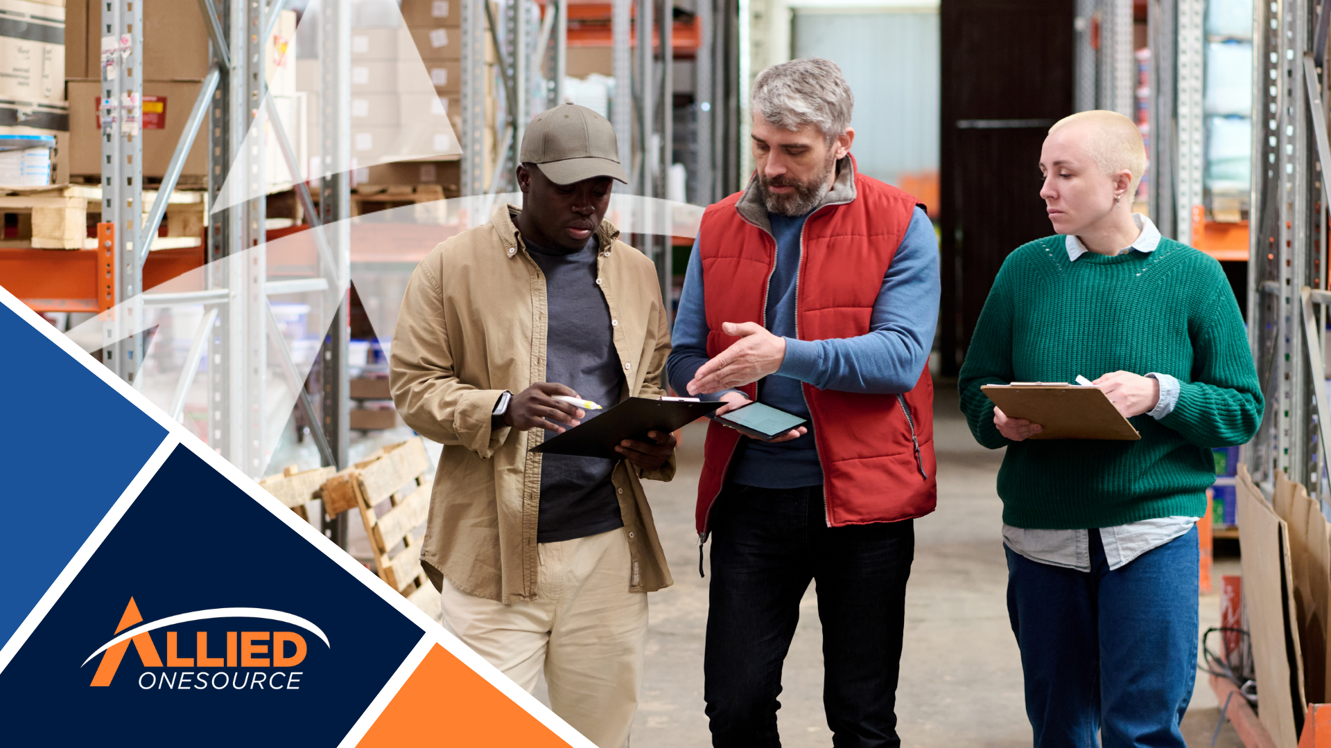 Three warehouse contractors with tablets and clipboards discussing project details, highlighting con