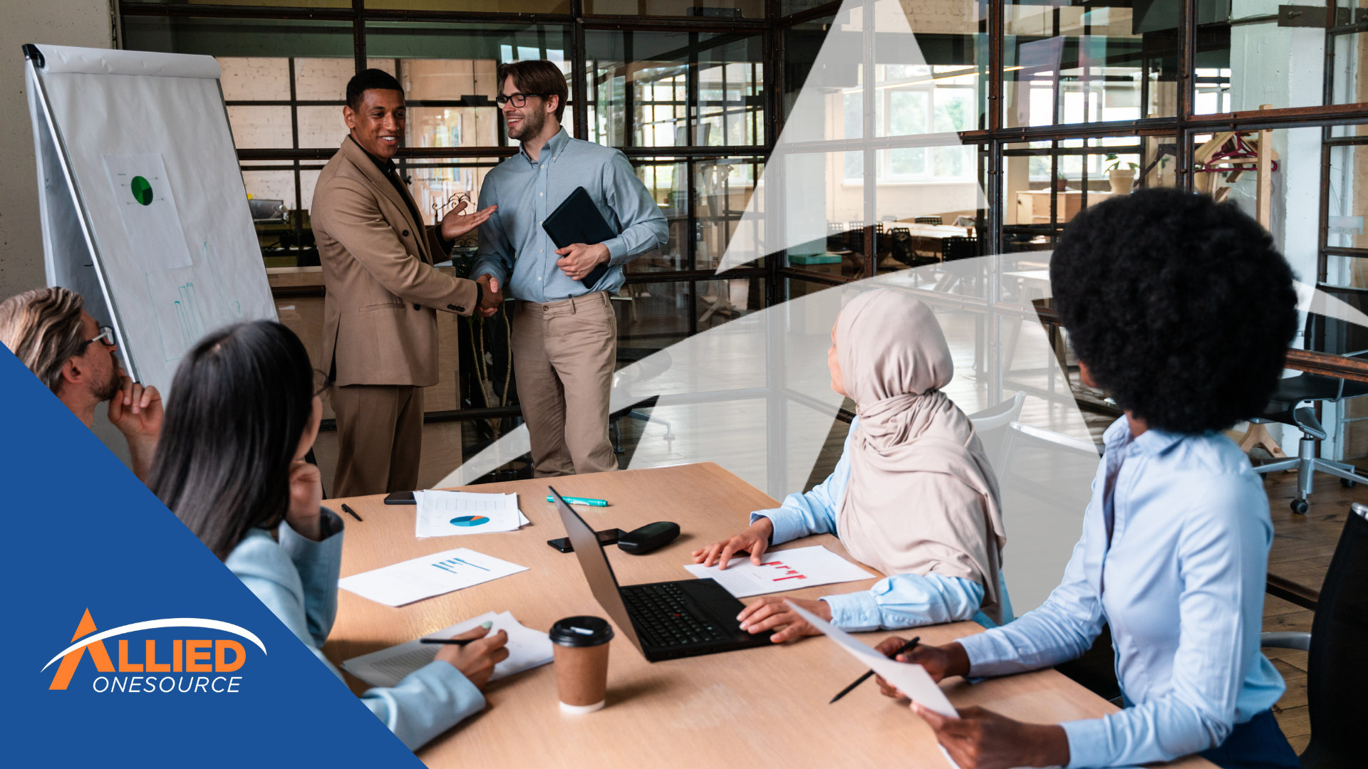 A diverse team of admin professionals engages in a workplace meeting, showg career tips for admins