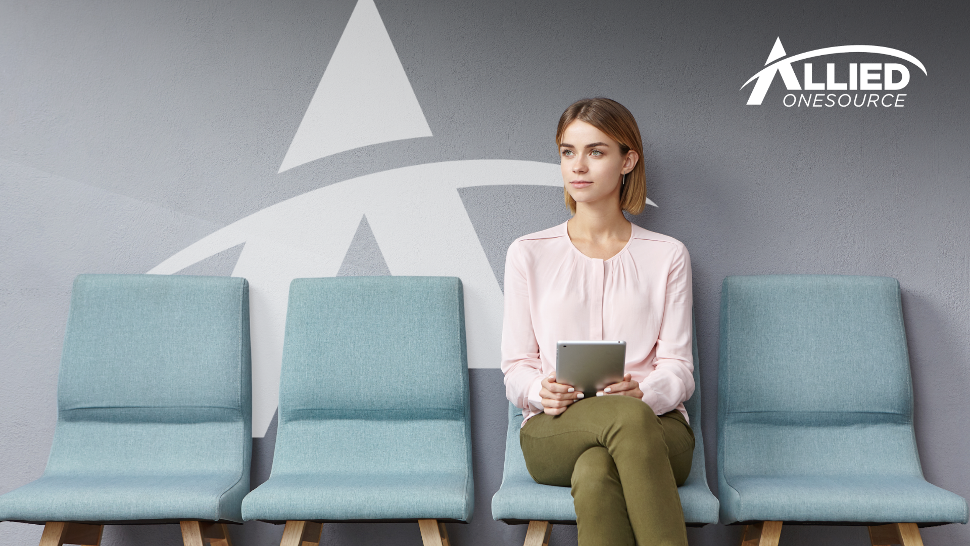 Job candidate waiting for an interview, illustrating the impact of a low show rate on staffing.