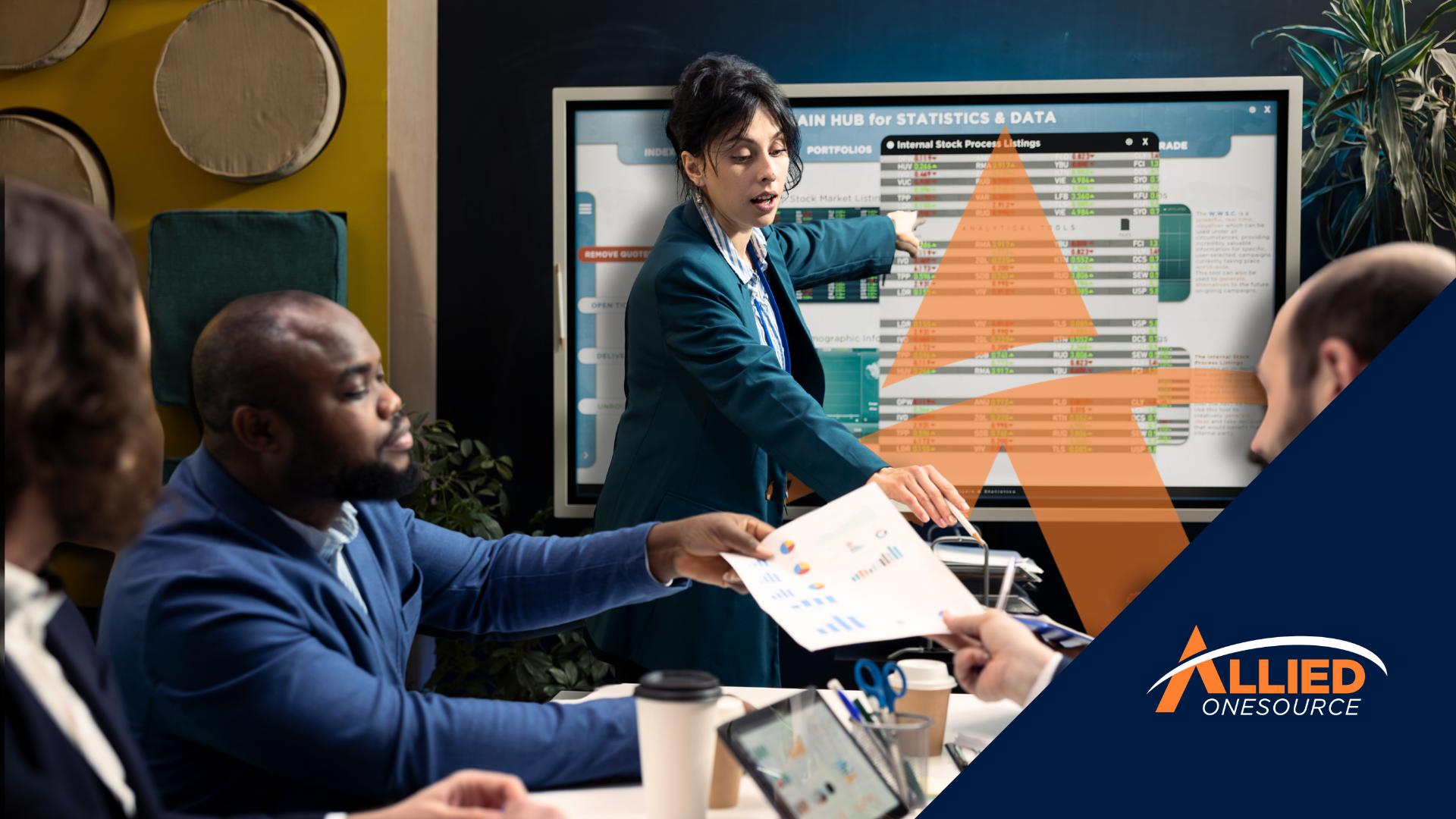 A finance professional presents data analytics to her team, demonstrating workforce productivity tip