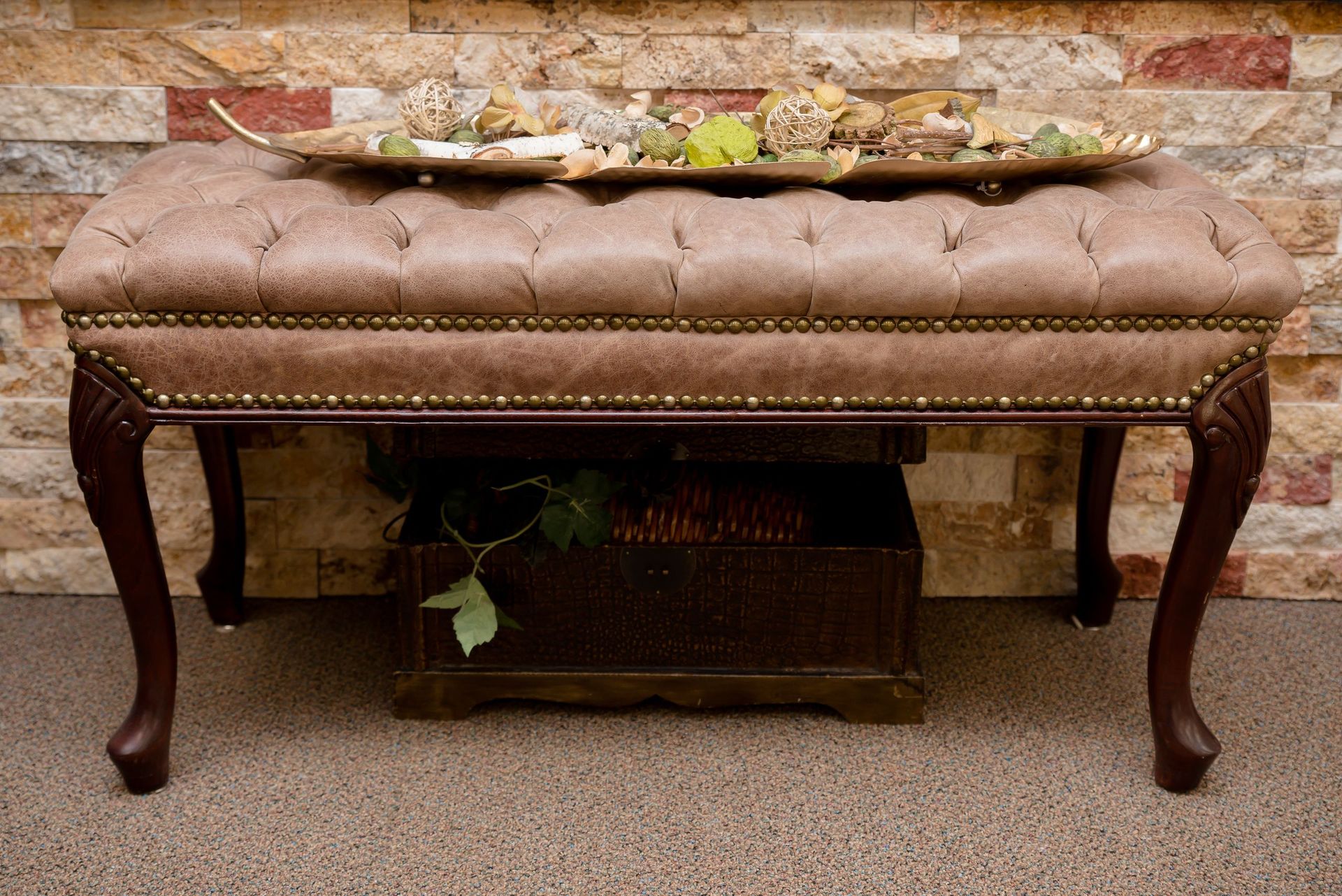 A brown ottoman with a tray on top of it