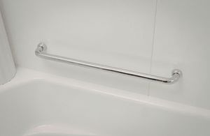 White bathroom grab bar mounted above a tub, with chrome brackets on tiled wall