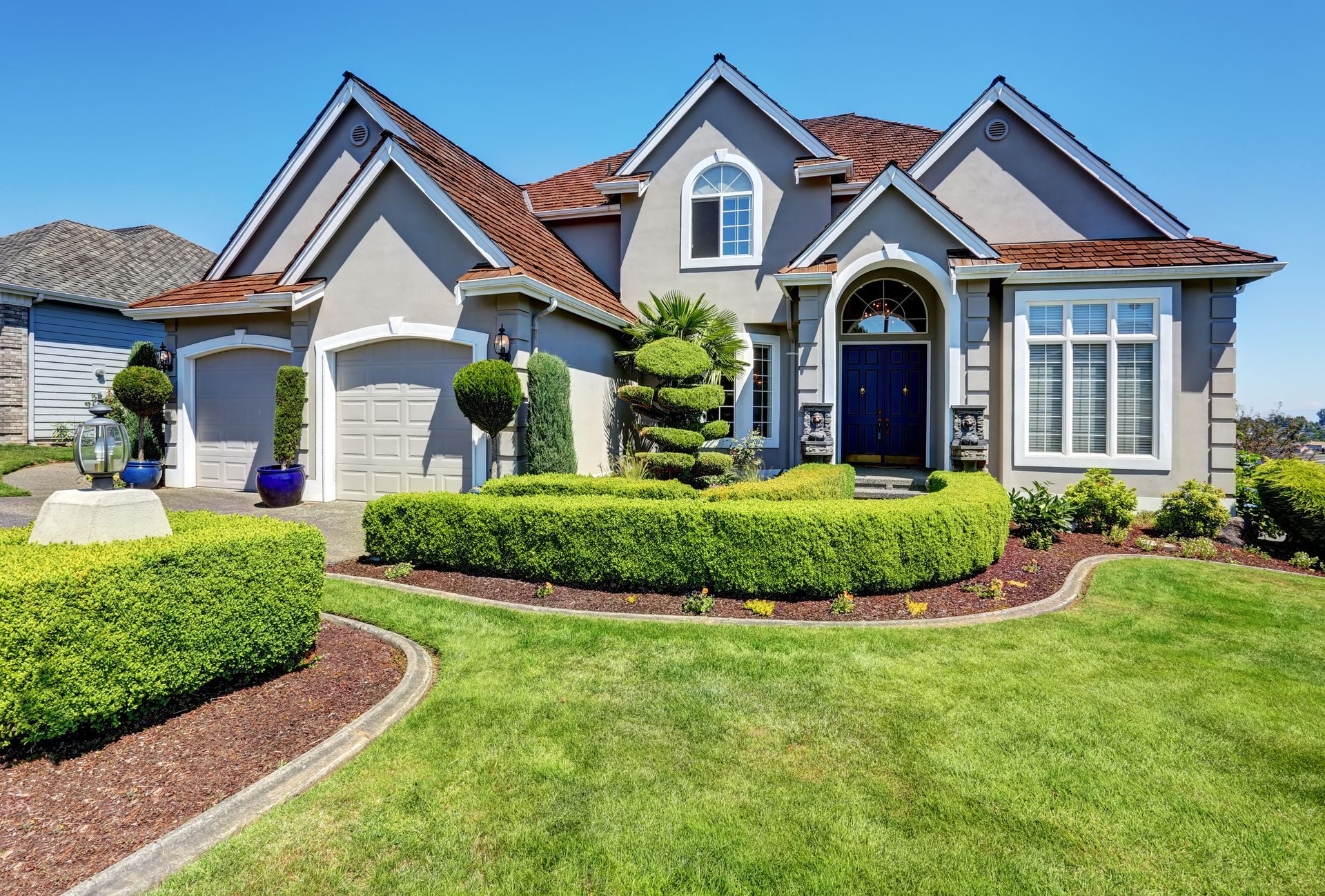house with curbing landscape yard