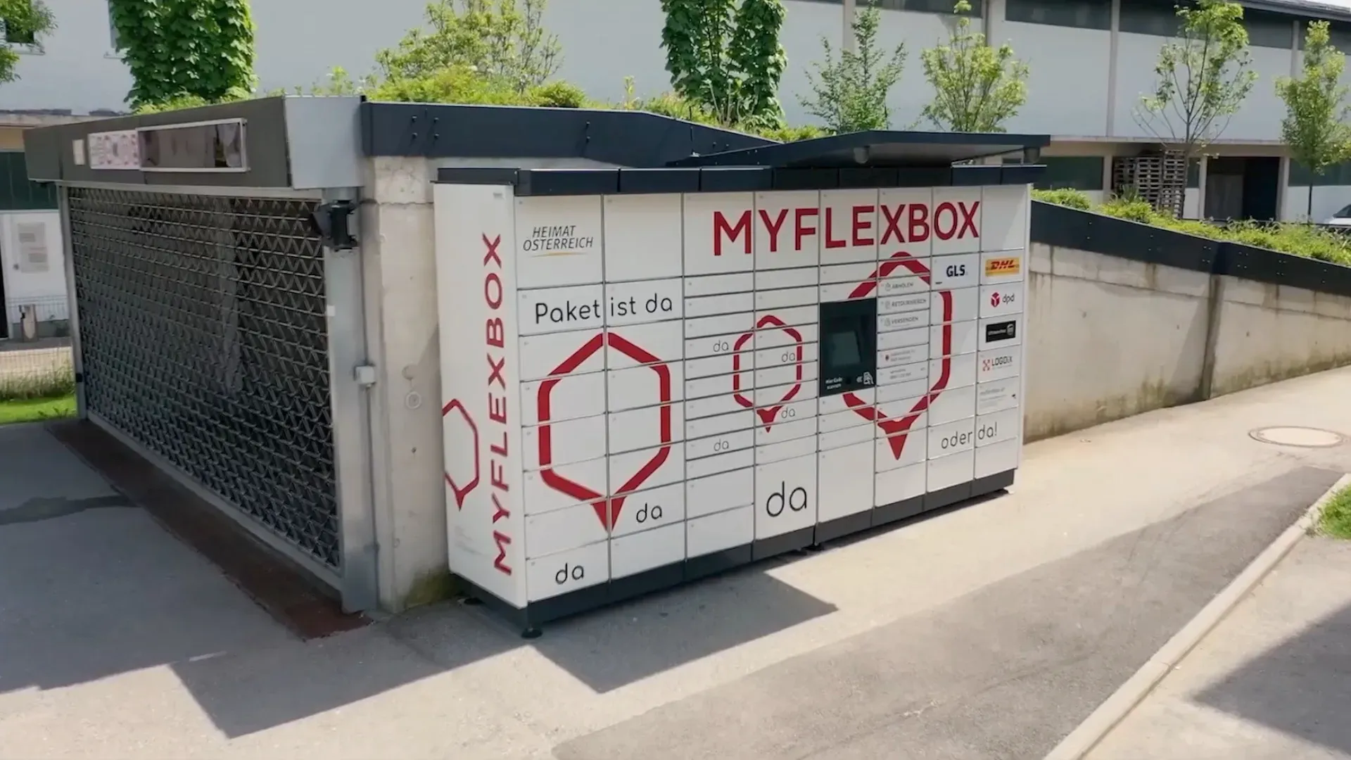 A myflexbox locker is sitting on the side of the road.