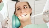 woman receiving cosmetic dental health services in Tweed Heads South