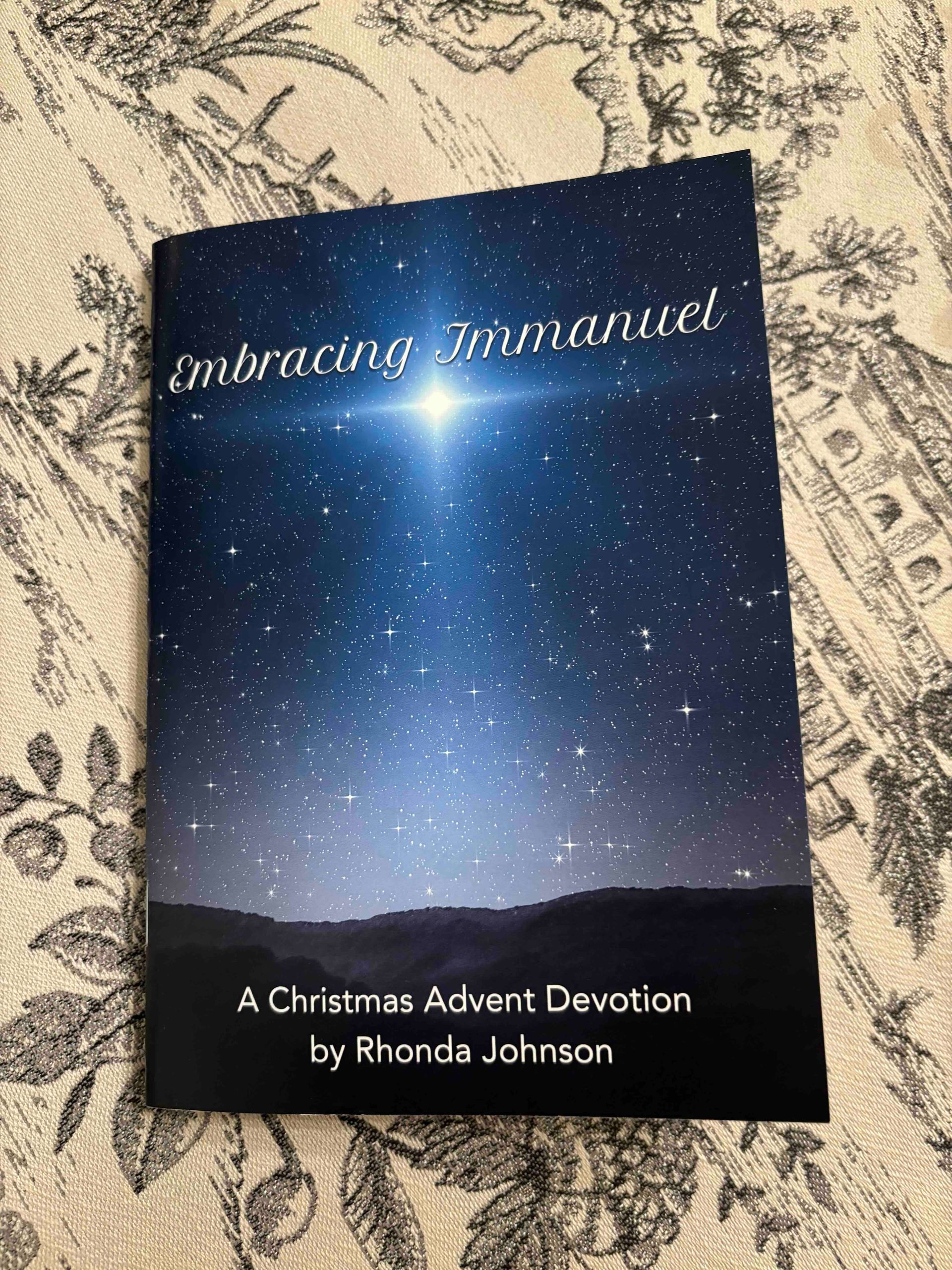 The book Embracing Immanuel, a Christmas devotion by Rhonda Johnson.