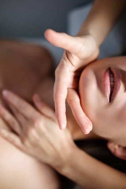 A Close Up Of A Woman's Face With A Hand On It – Coral Springs, FL - Life In Motion Bodyworks and Aesthetics