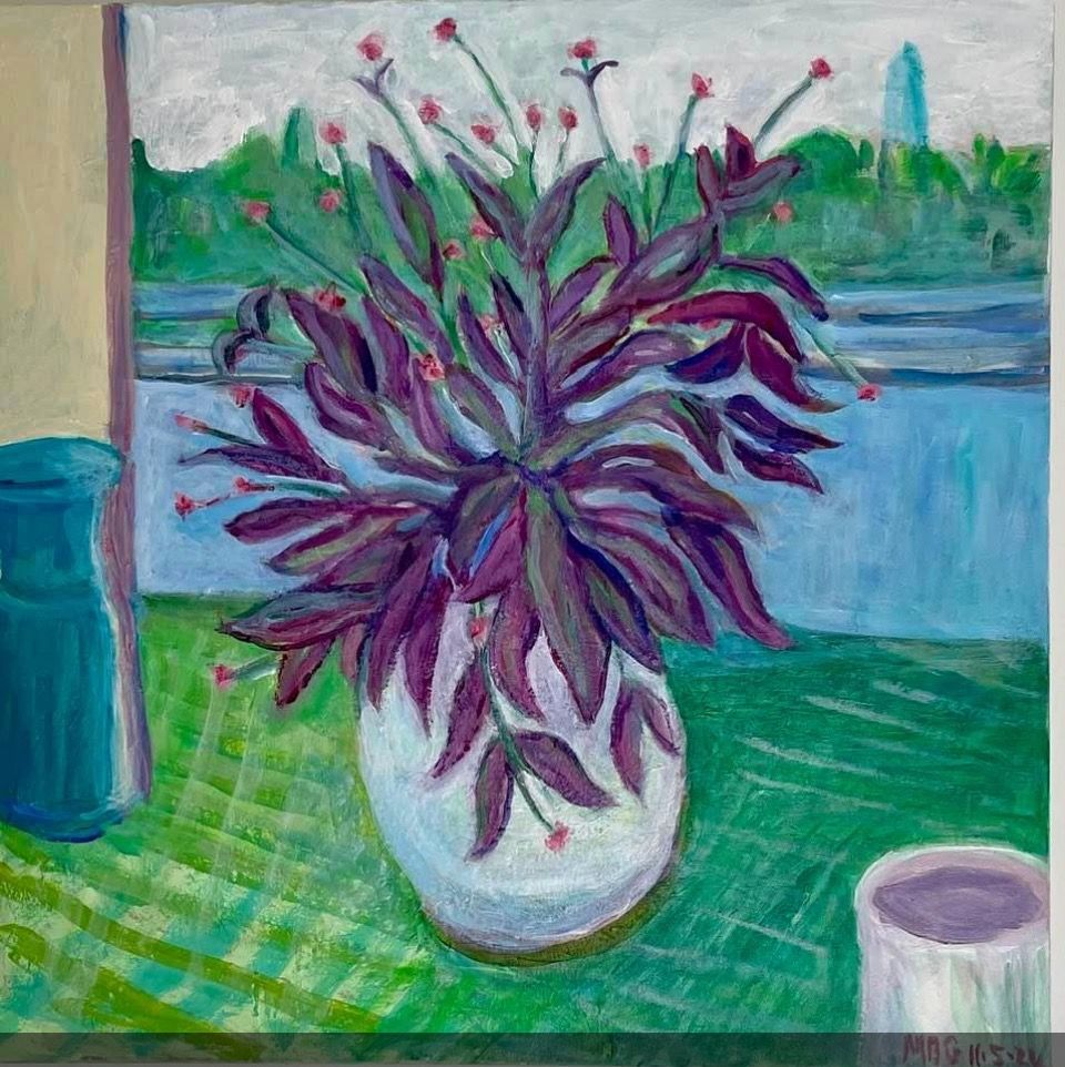 Purple-leaf plant in a white pot on a green table by a window, with a blue vase and cup nearby.