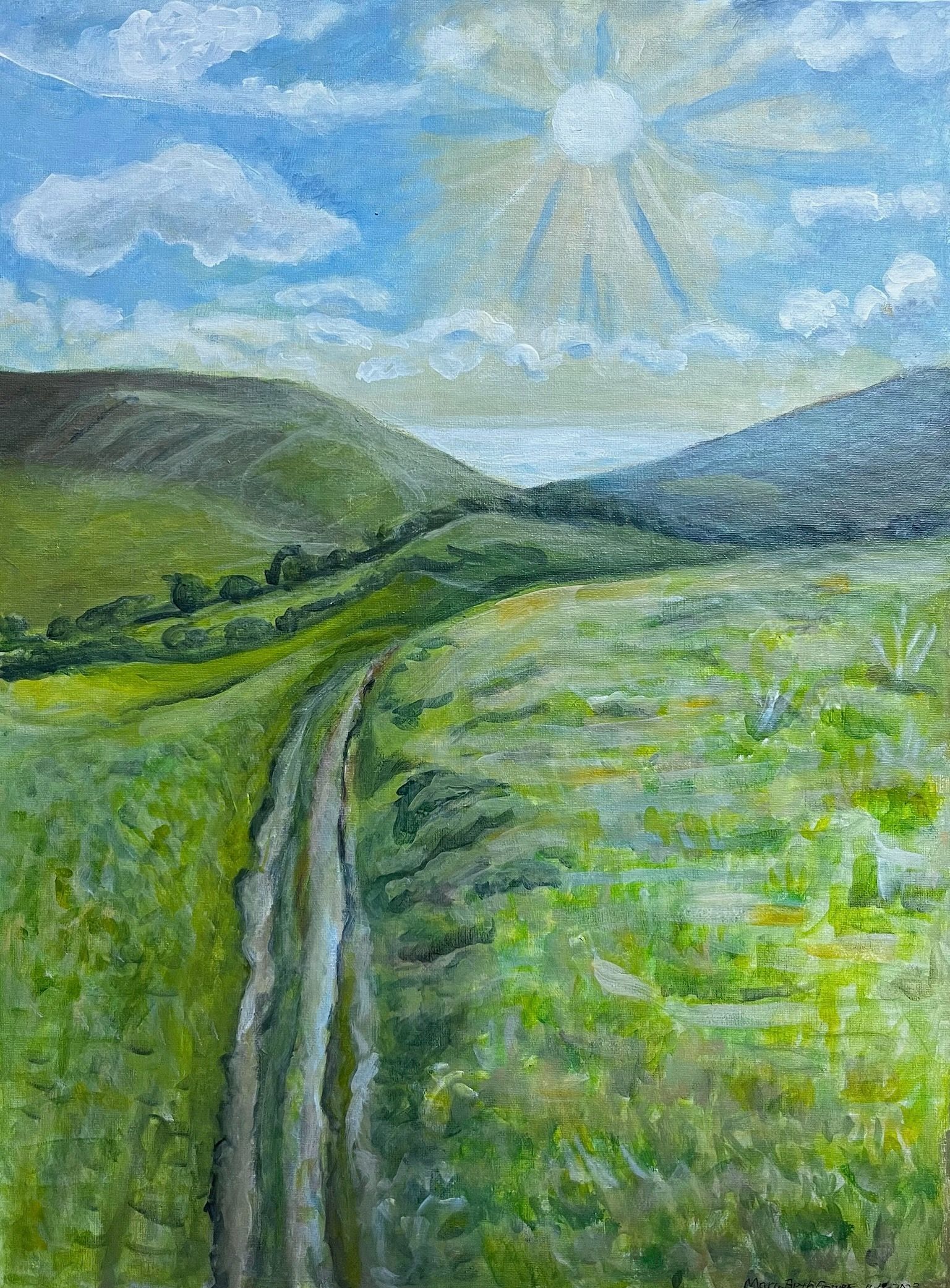A narrow path through green hills under a bright blue sky with clouds and sunbeams.