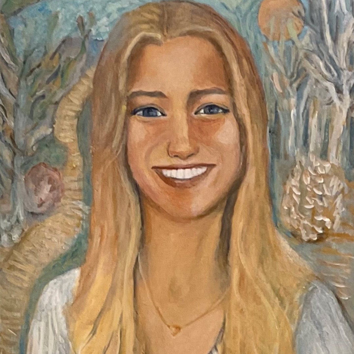 Smiling blonde woman in a light top against a textured blue floral background