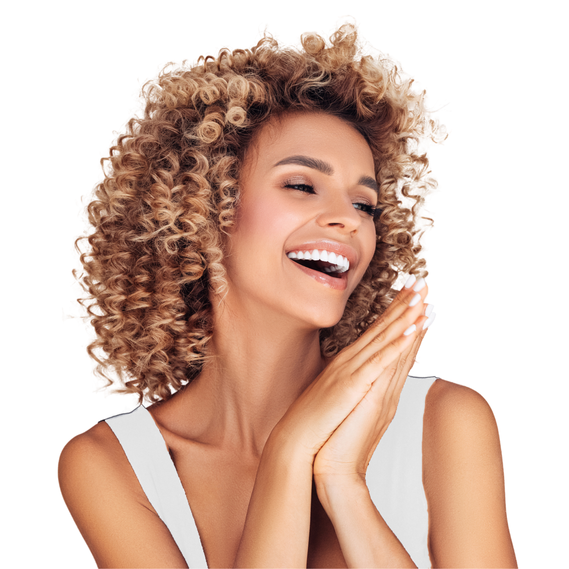 A woman with curly hair is smiling and covering her face with her hands