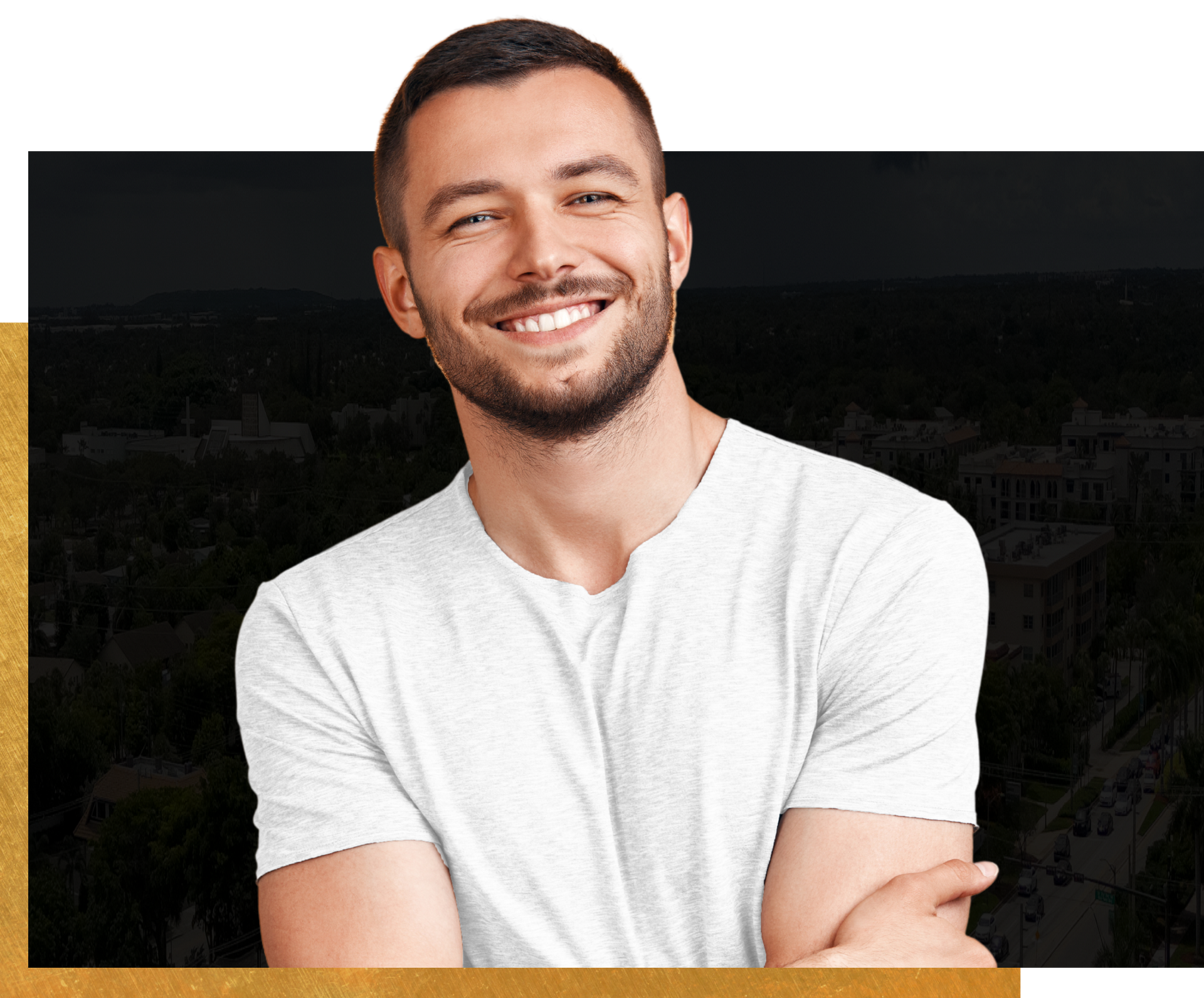 A man in a white shirt is smiling with his arms crossed.