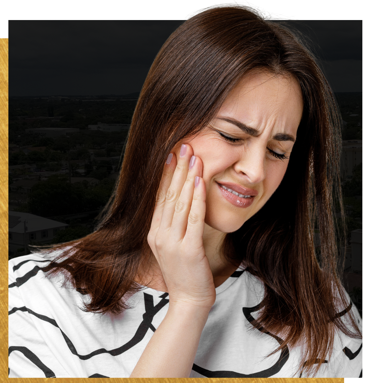 A woman is holding her face in pain because of a toothache