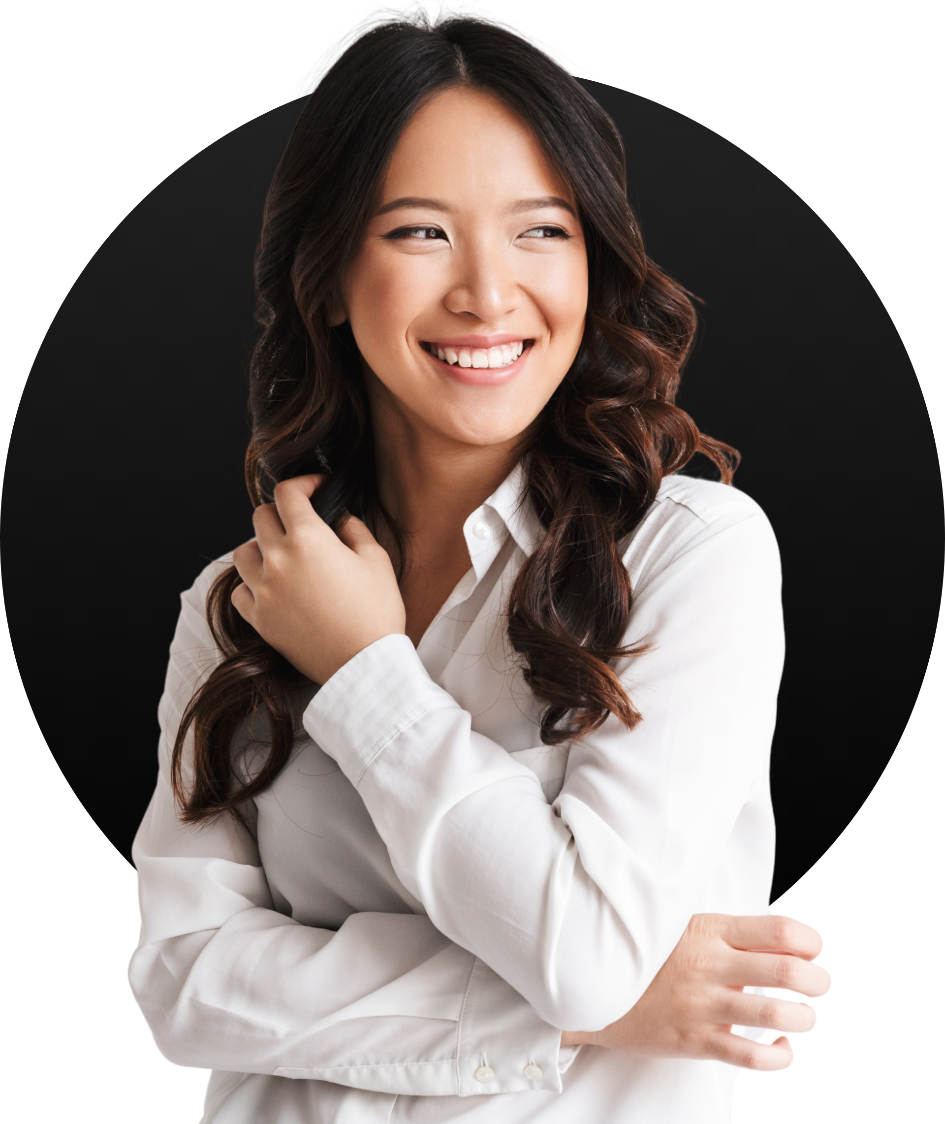 A woman in a white shirt is smiling with her arms crossed