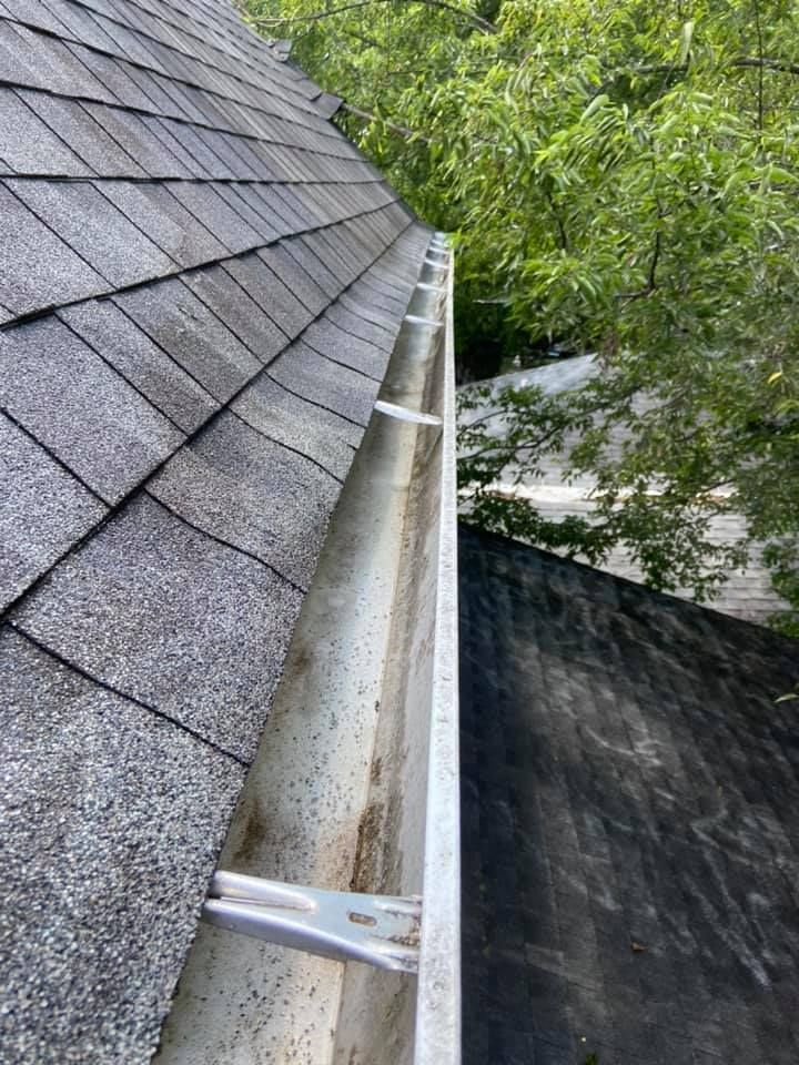 Recently cleaned gutters on a residential roof in Lebanon, TN, showcasing professional gutter maintenance services.